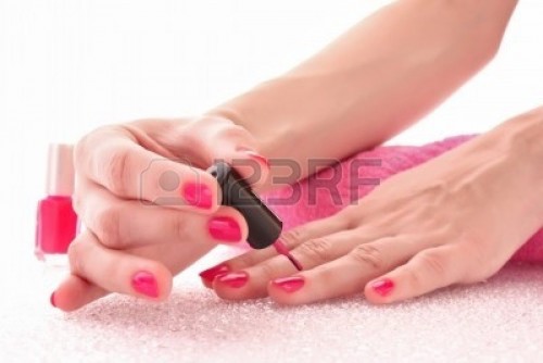 7573789-woman-applying-pink-nail-polish.jpg